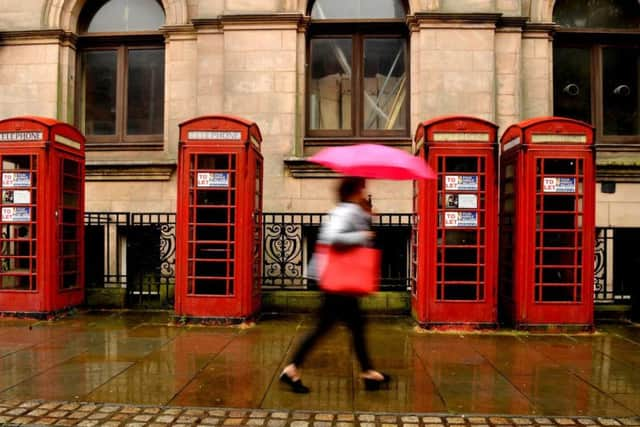 The row of red phone boxes outside the former Head Post Office in Market Street have seen better days