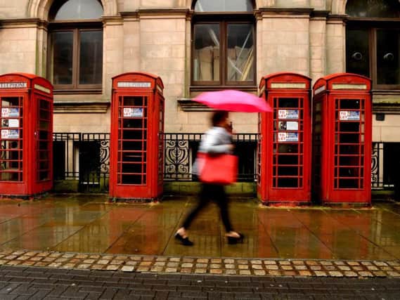 The row of red phone boxes outside the former Head Post Office in Market Street have seen better days