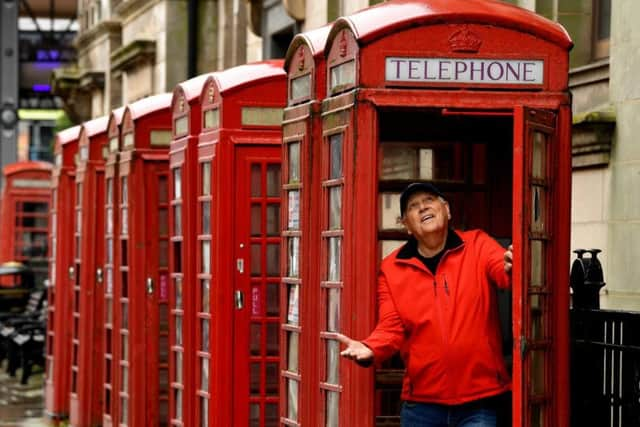 The row of red phone boxes outside the former Head Post Office in Market Street have seen better days