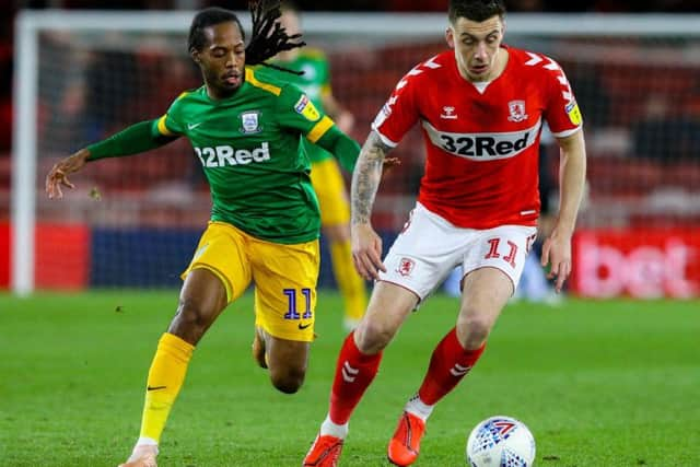 Jordan Hugill is shadowed by PNE midfielder Daniel Johnson when playing for Middlesbrough in March