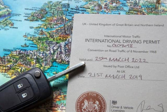 An International Driving Permit issued by the Post Office