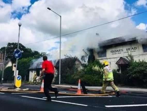 The road is closed after a fire at the Boar's Head in Barton.