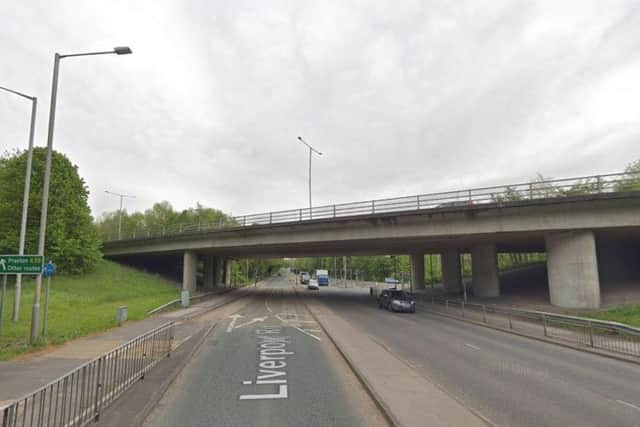 A 26-year-old woman has been arrested after she came off the bridge above Liverpool Road and landed on a stationary lorry this morning (July 19)