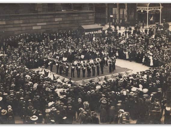 Military band entertains the crowds to mark Peace Day, on Prestons Flag Market on July 19, 1919