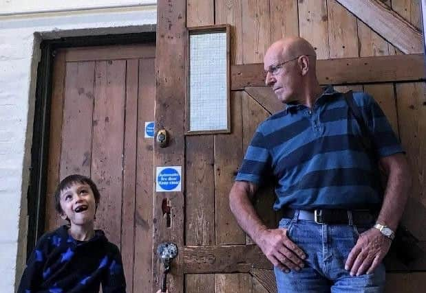 Harry Hesketh with his grandson at Salts Mill (Yorkshire Post)