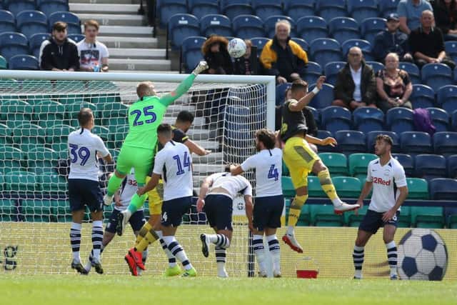 Preston goalkeeper Connor Ripley punches clear