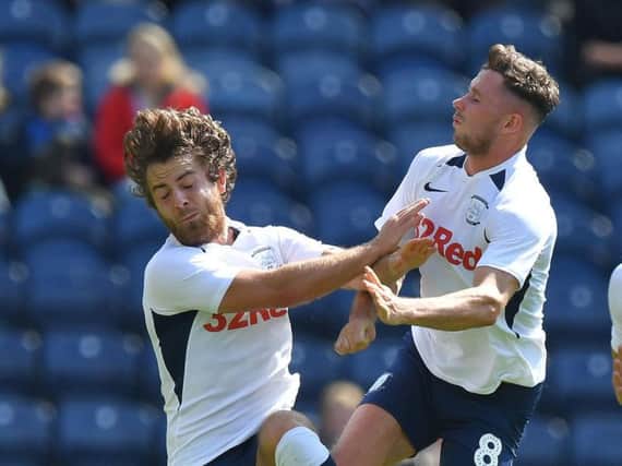Preston's Ben Pearson and Alan Browne compete for the same ball against Southampton at Deepdale