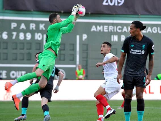 Andrew Lonergan takes a cross playing for Liverpool against Sevilla in Boston