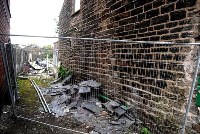 Fly-tipped waste at the derelict Moor Inn pub