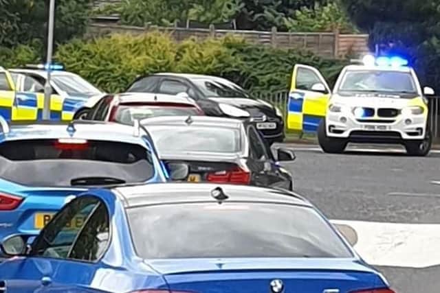 The Citroen DS3 was surrounded by police after it crashed into a bollard at a roundabout in King Street, Leyland. Credit: Laura Swarbrick
