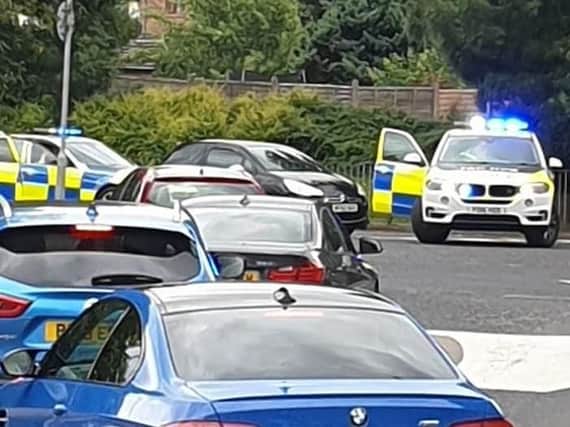 The Citroen DS3 was surrounded by police after it crashed into a bollard at a roundabout in King Street, Leyland. Credit: Laura Swarbrick
