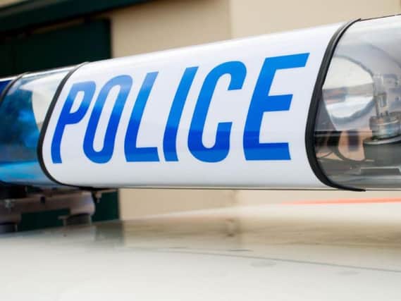 Detectives have launched an investigation after a man was shot and firearms stolen during an armed robbery in Aughton, near Ormskirk
