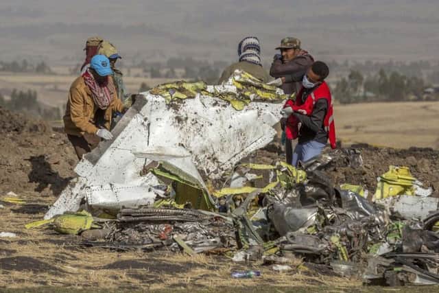 Rescuers work at the scene of the Ethiopian Airlines flight crash