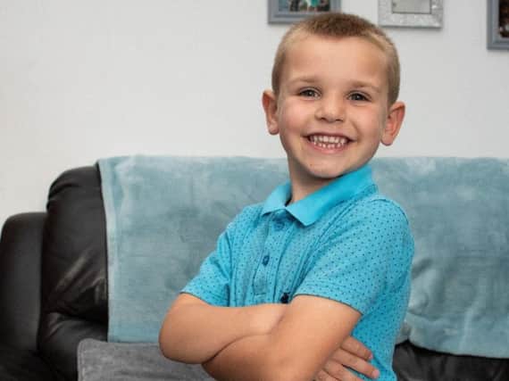 Jaxon Youd, 5, has been hailed a hero after saving a dog from drowning in a stream in Hoghton. Photo: Kelvin Stuttard