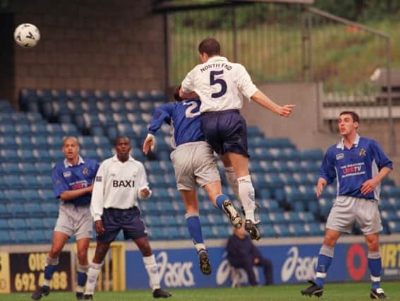 Michael Jackson heads Preston's second goal at Millwall in April 1999