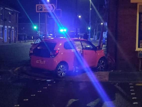 The Toyota Aygo collided with a traffic sign before crashing into the corner of Holdens Estate Agents in Watkin Lane, Lostock Hall last night (August 1)