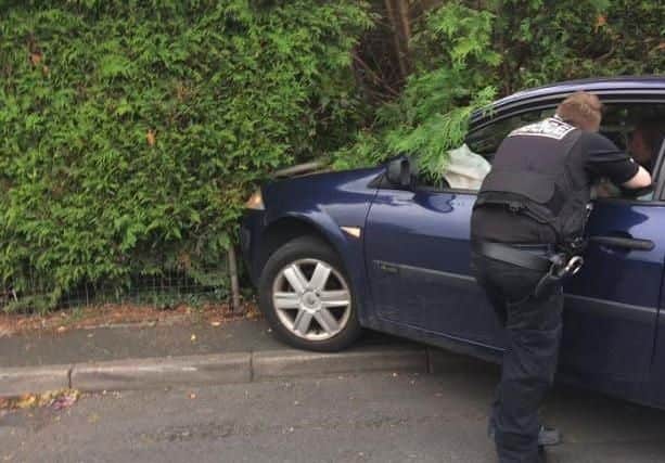 Police later found two knives hidden under the front seats of the abandoned Renault Megane following the crash in School Lane, Lostock Hall on Thursday, August 1. Pic credit: Jean Berry