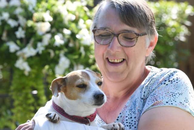 Collette Martin, who broke her wrist in a fall near a brook in Hoghton, with her dog, Roxy, who became stuck in the water.