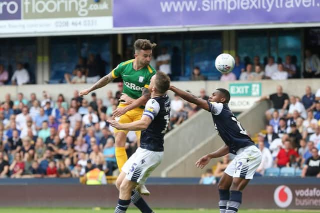 Preston striker Sean Maguire gets a header away against Millwall at The Den