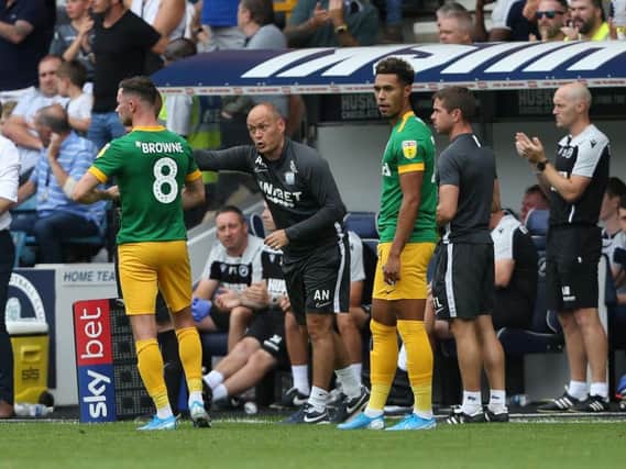 Preston manager Alex Neil gives instructions to Alan Browne and Andre Green against Millwall at The Den