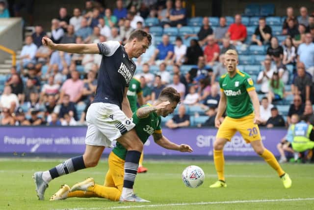 Preston striker Sean Maguire goes down under Jake Cooper's challenge but no penalty was given