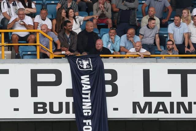 Preston supporters in the away end at The Den