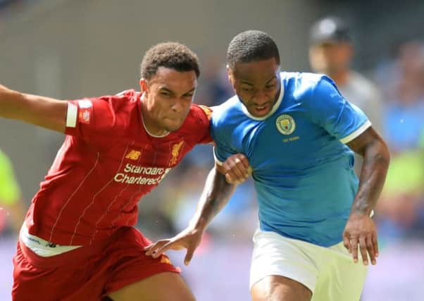 Liverpool's Trent Alexander-Arnold (left) and Manchester City's Raheem Sterling battle for the ball during the Community Shield match at Wembley Stadium (photo: PA)