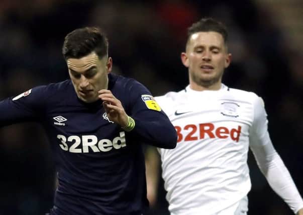 Preston's Alan Browne and Derby winger Tom Lawrence  during last seasons '32Red derby' clash at Deepdale