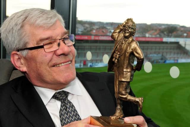 Former Luton Town and England player Malcolm McDonald with the Eric Morecambe Trophy at the Globe Arena