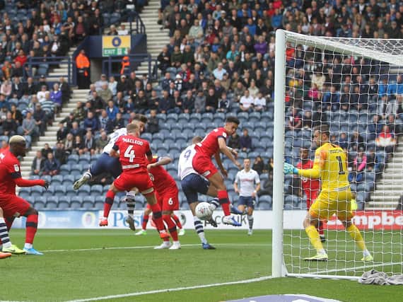 Sean Maguire heads Preston into the lead against Wigan Athletic at Deepdale