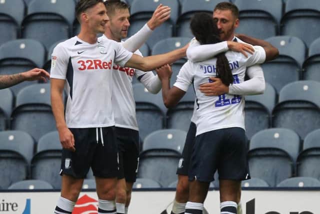 Louis Moult is congratulated by Daniel Johnson, Paul Gallagher and Ben Davies after scoring Preston's second goal against Wigan