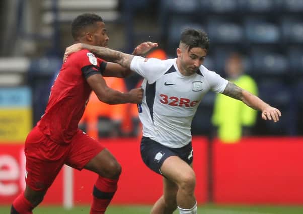Sean Maguire takes on Wigan right-back Nathan Byrne at Deepdale