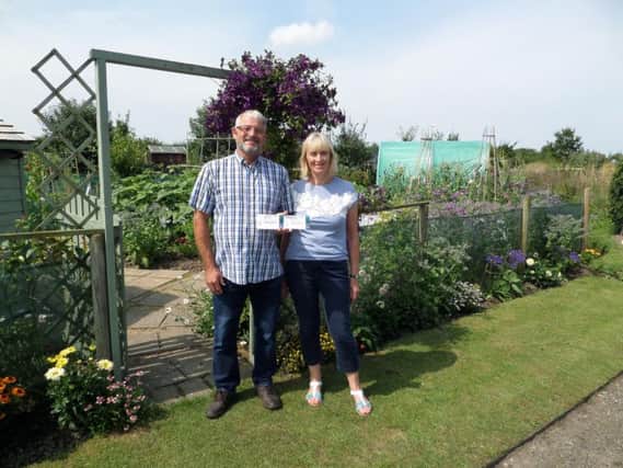 Fred and Susan Smith, owners of Plot 37 on Hesketh Bank Allotments, are celebrating winning the Allotment Category in the Parish Councils Best Kept competition for the third time.