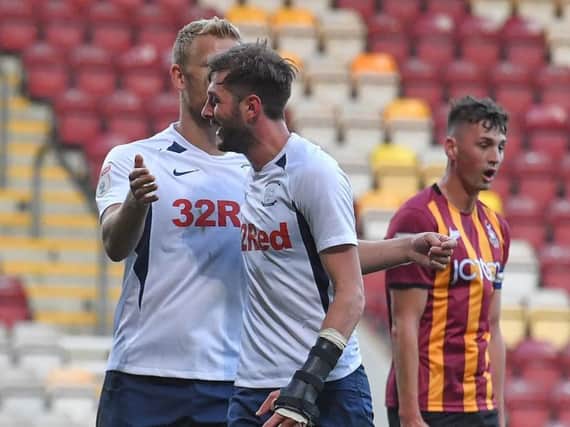 Tom Barkhuizen is congratulated by Jayden Stockley after scoring PNE's second goal at Bradford