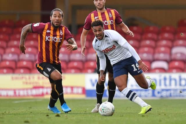 Preston winger Andre Green escapes the attention of two Bradford players
