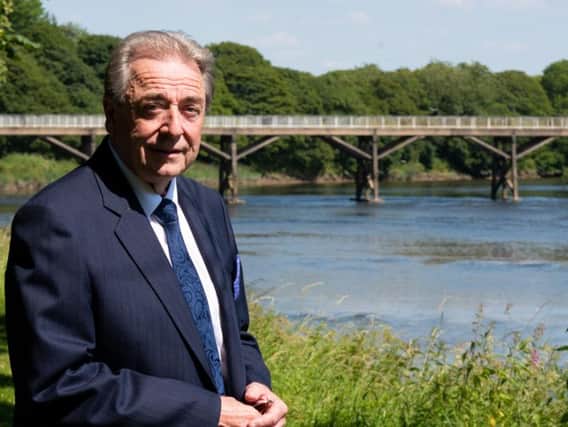 Keith Iddon, cabinet member for Highways and Transport and deputy leader of Lancashire County Council in front of the old Tram Road Bridge in Avenham Park, Preston.