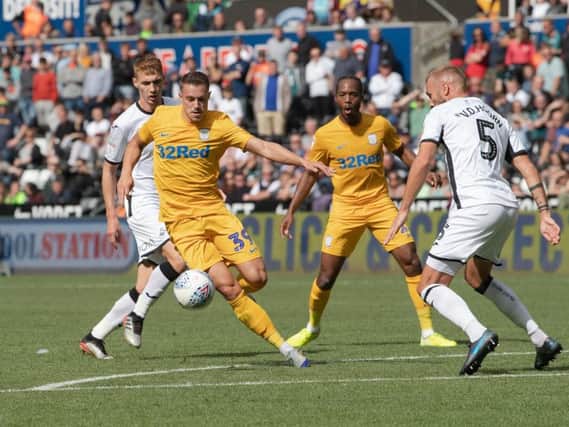 Preston winger Billy Bodin on the attack against Swansea at the Liberty Stadium