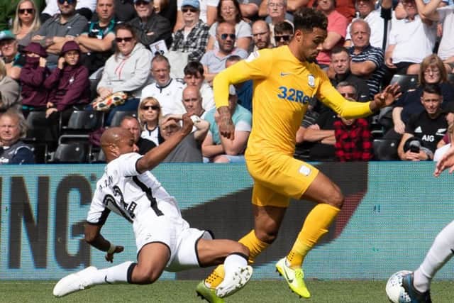 Preston North End's Andre Green (right) is tackled by Swansea City's Andre Ayew (left)
