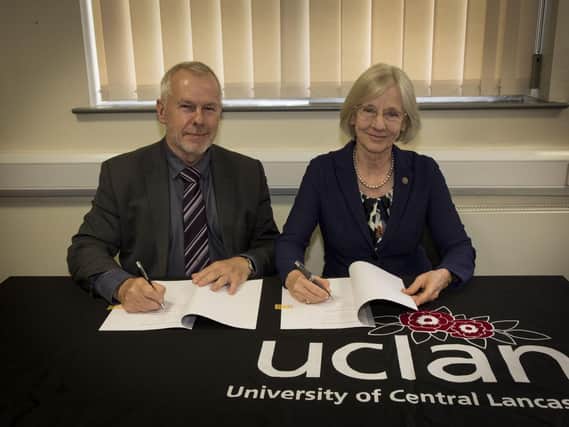 UCLan executive dean  Prof Nigel Harrison with Professor Dr Anne Friedrichs, President, Hsg Bochum signing the new partnership agreement.