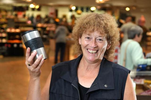 Booths have launched to cut down on the use of plastic in stores 
Julie Hedley, one of the many shoppers to bring their own cups for a refill