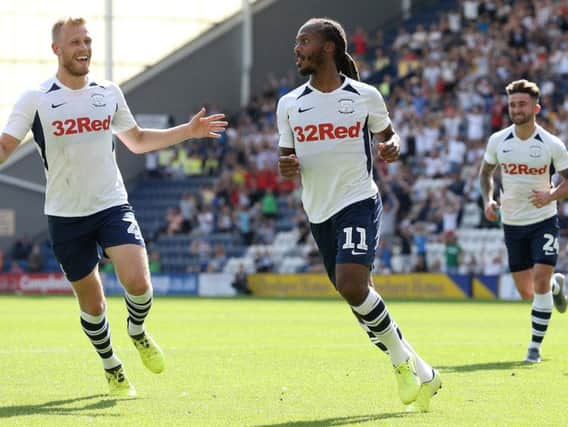Daniel Johnson celebrates with Jayden Stockley and Sean Maguire after putting PNE 1-0 up from the spot