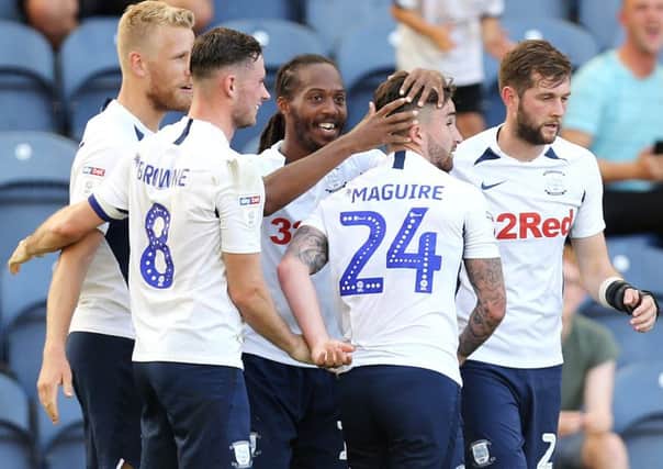 Preston North End's Daniel Johnson (Ctr) celebrates with team-mates after scoring his side's second goal from the penalty spot