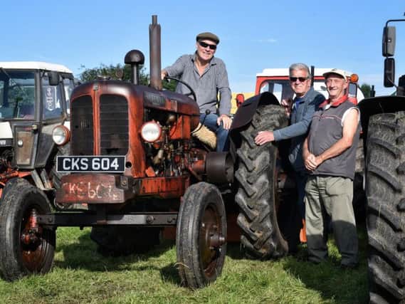 Jim Smith, David Hodgson and Bob Cross with a Nuffield Universal Perkins P4 1951 tractor