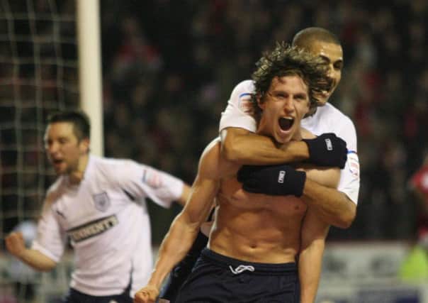 Bare-chested Billy Jones celebrates his last-gasp equaliser at Forest