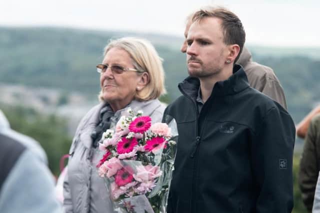 Following the moments silence, a choir sang Amazing Grace as people started to lay flowers
