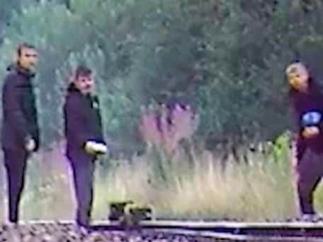 Police want to speak to these three boys. Concrete debris can be seen on the track lines (Photo: British Transport Police)