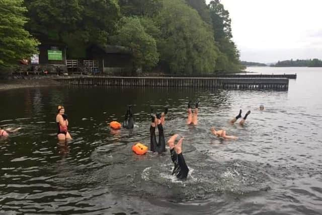 M.A.L.L.O.W.S open water swimmers couldnt resist a group handstand after a swim