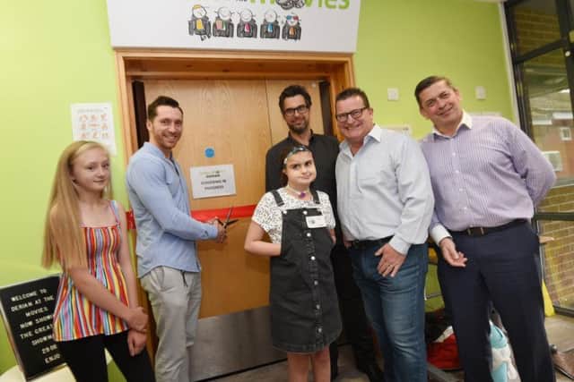 Wigan actor Ben Batt, officially opens the new family cinema facility, Derian at the Movies, at Derian House, Chorley, from left, Francesca, actor Ben Batt, Amelie, Stephen Nevison from Intuitive Homes, Ian Morrish from Together For Cinema and David Robinson CEO of Derian House