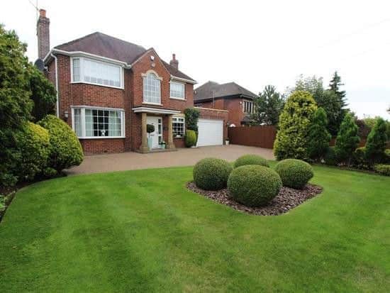 The house boasts attractive gardens to the front.