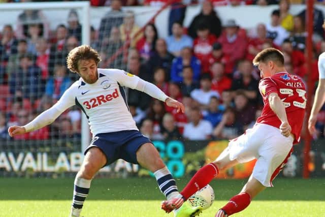Ben Pearson tackles Nottingham Forest winger Joe Lolley